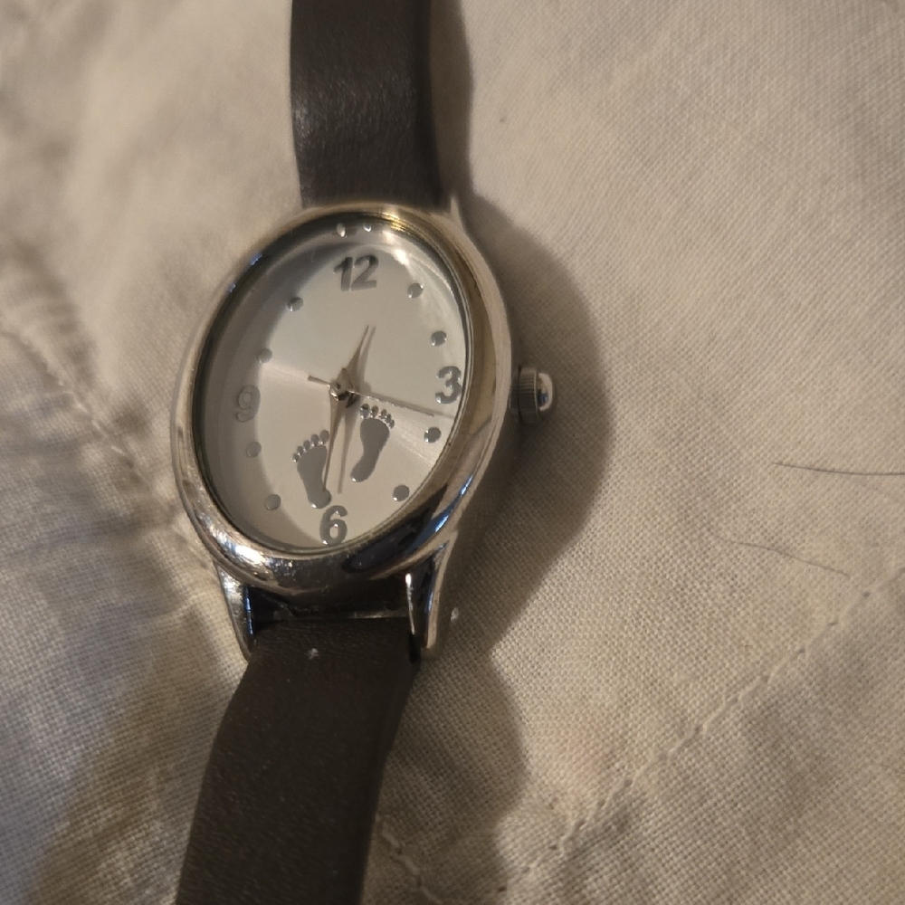 Footprints in the sand,  Leather Strap Watch w cross at  buckle